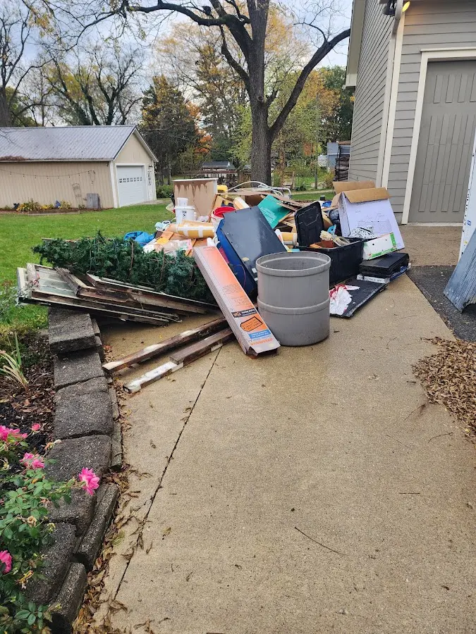 Dumpster being loaded with debris for Demolition Dumpster Rental in Lancaster